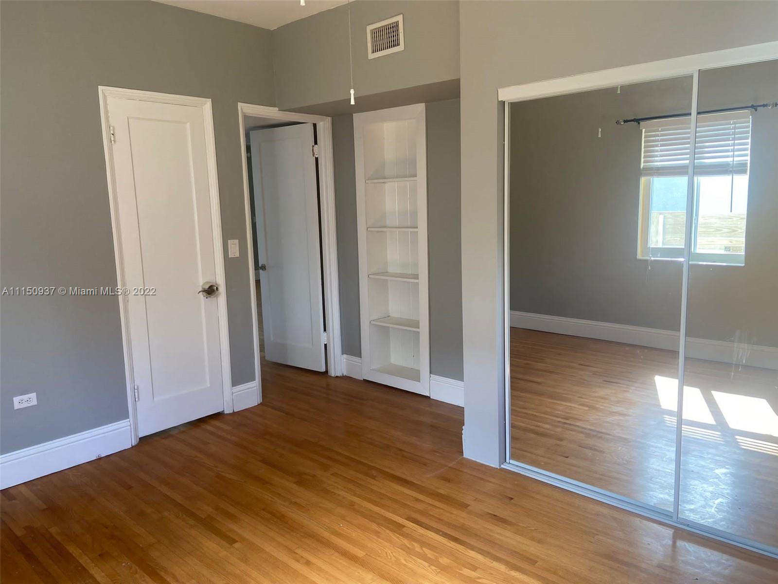 155 Southwest 28th Road Miami, FL 33129 - Photo 18 of 33 a view of a room with wooden floor and entryway