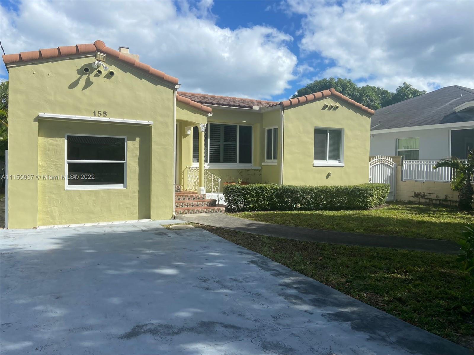 155 Southwest 28th Road Miami, FL 33129 - Photo 2 of 33 a front view of a house with a yard