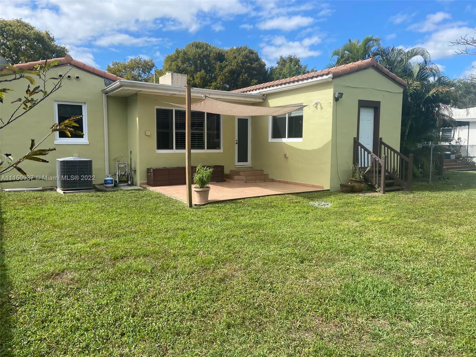 155 Southwest 28th Road Miami, FL 33129 - Photo 32 of 33 a view of a house with a yard and sitting area