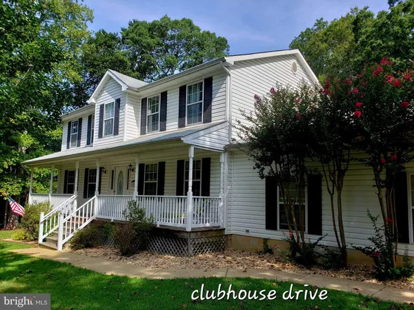 a view of outdoor space yard and front view of a house