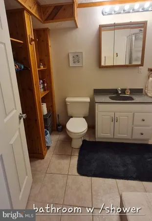 a bathroom with a toilet and a sink