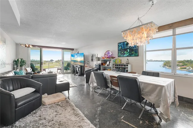 a living room with furniture a window and a table