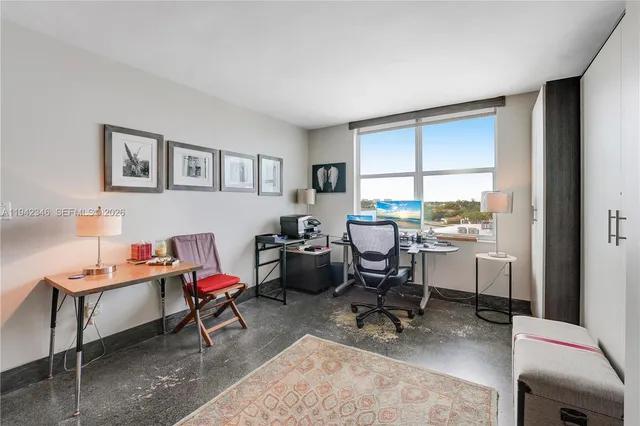 a workspace with furniture and a window