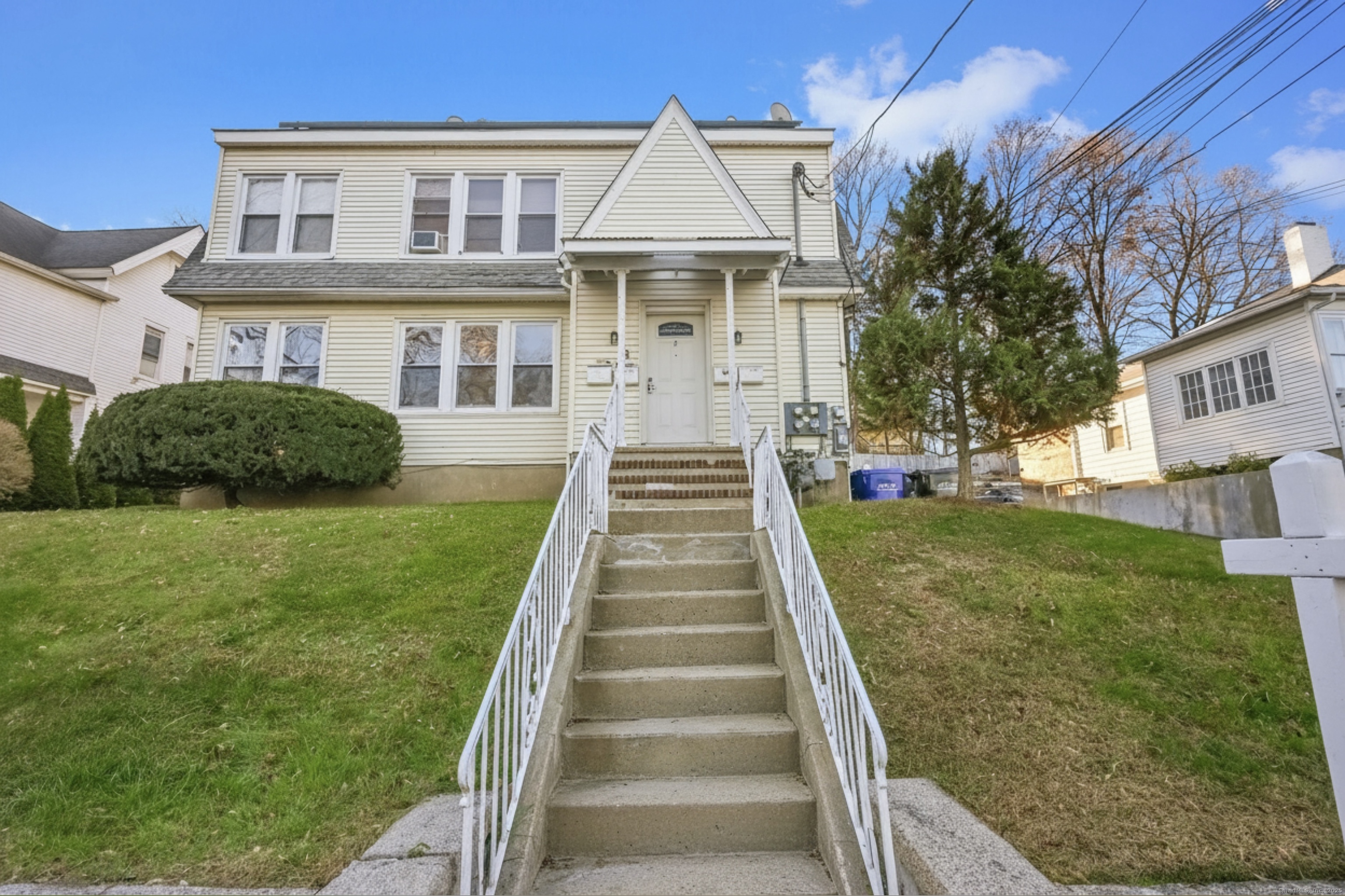 8 Smith Street, Unit 1 Danbury, CT 06810 - Photo 1 of 23 a front view of a house with a yard