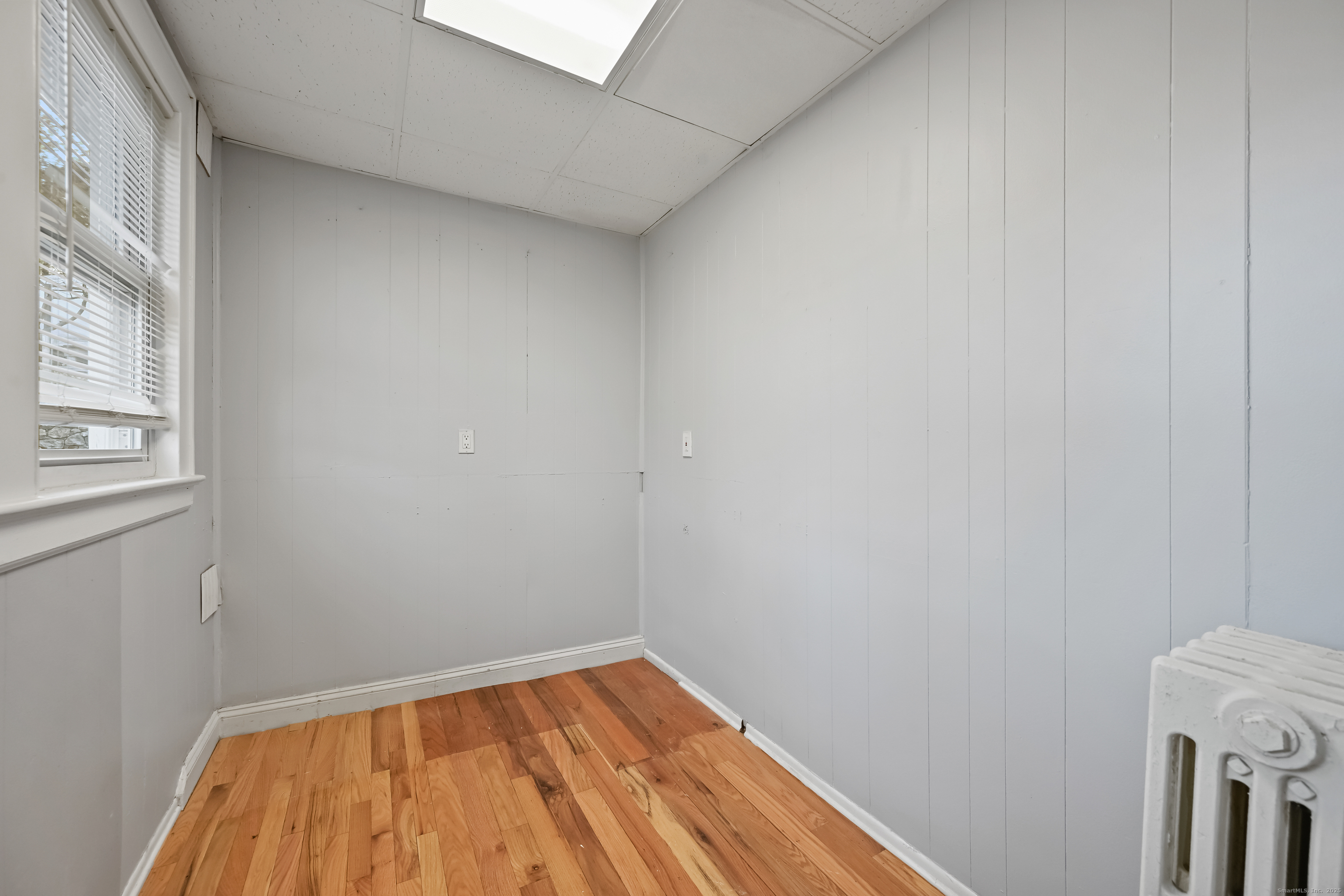 8 Smith Street, Unit 1 Danbury, CT 06810 - Photo 15 of 23 a view of a room that has a window in it