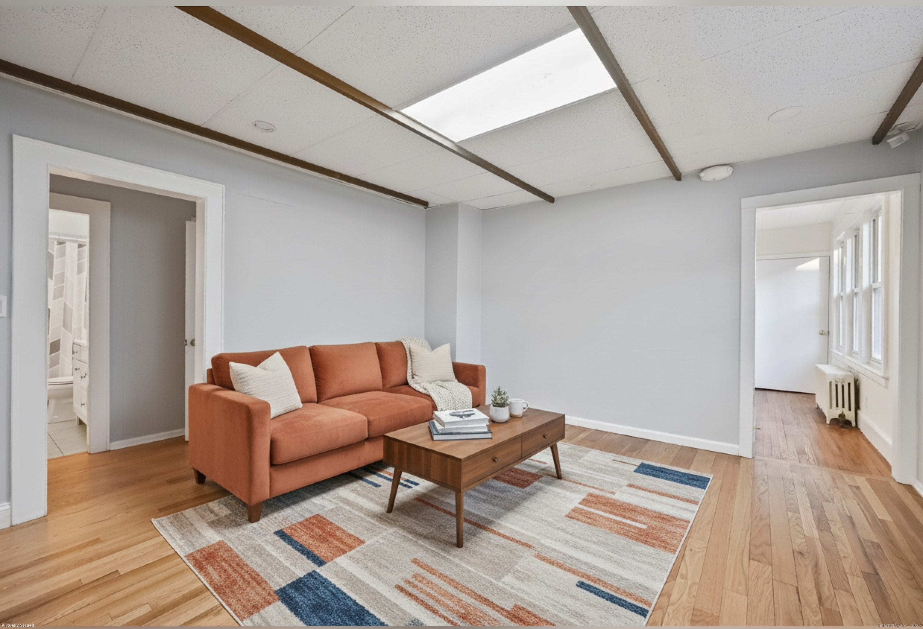 8 Smith Street, Unit 1 Danbury, CT 06810 - Photo 21 of 23 a living room with couch and a wooden floor