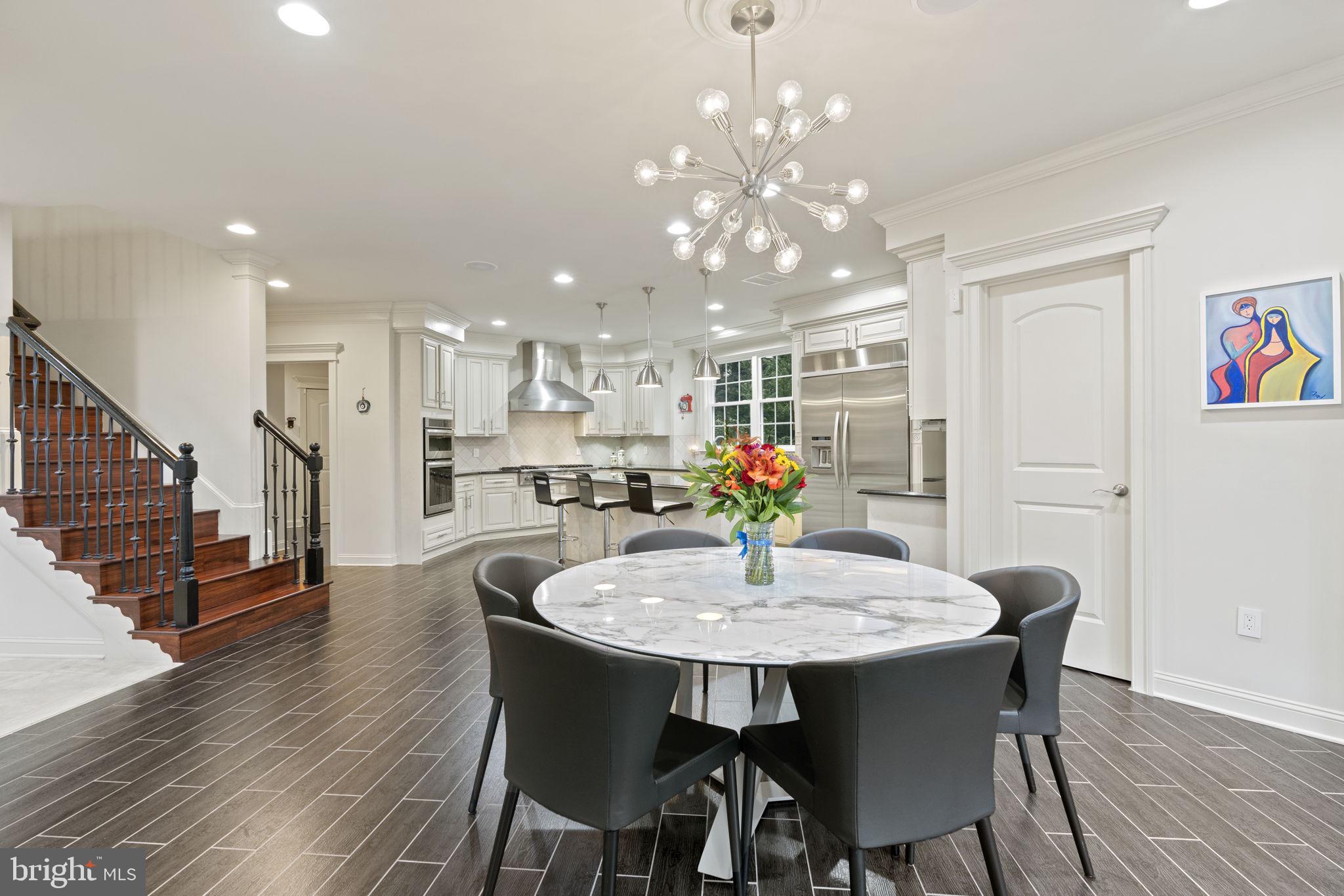1204 Allendale Road McLean, VA 22101 - Photo 13 of 62 a view of a dining room with furniture and wooden floor