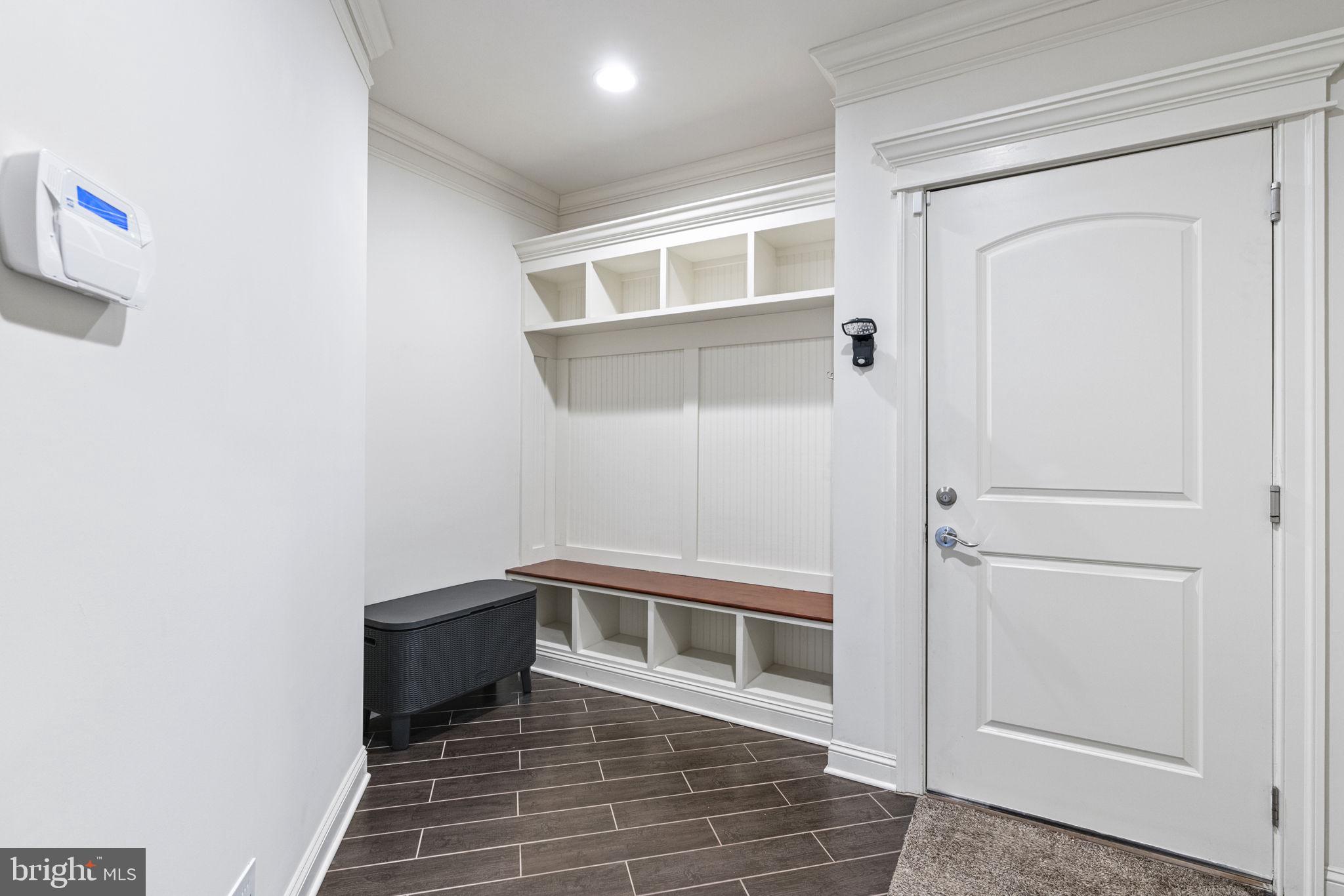 1204 Allendale Road McLean, VA 22101 - Photo 15 of 62 a view of a hallway with wooden floor and a bathroom