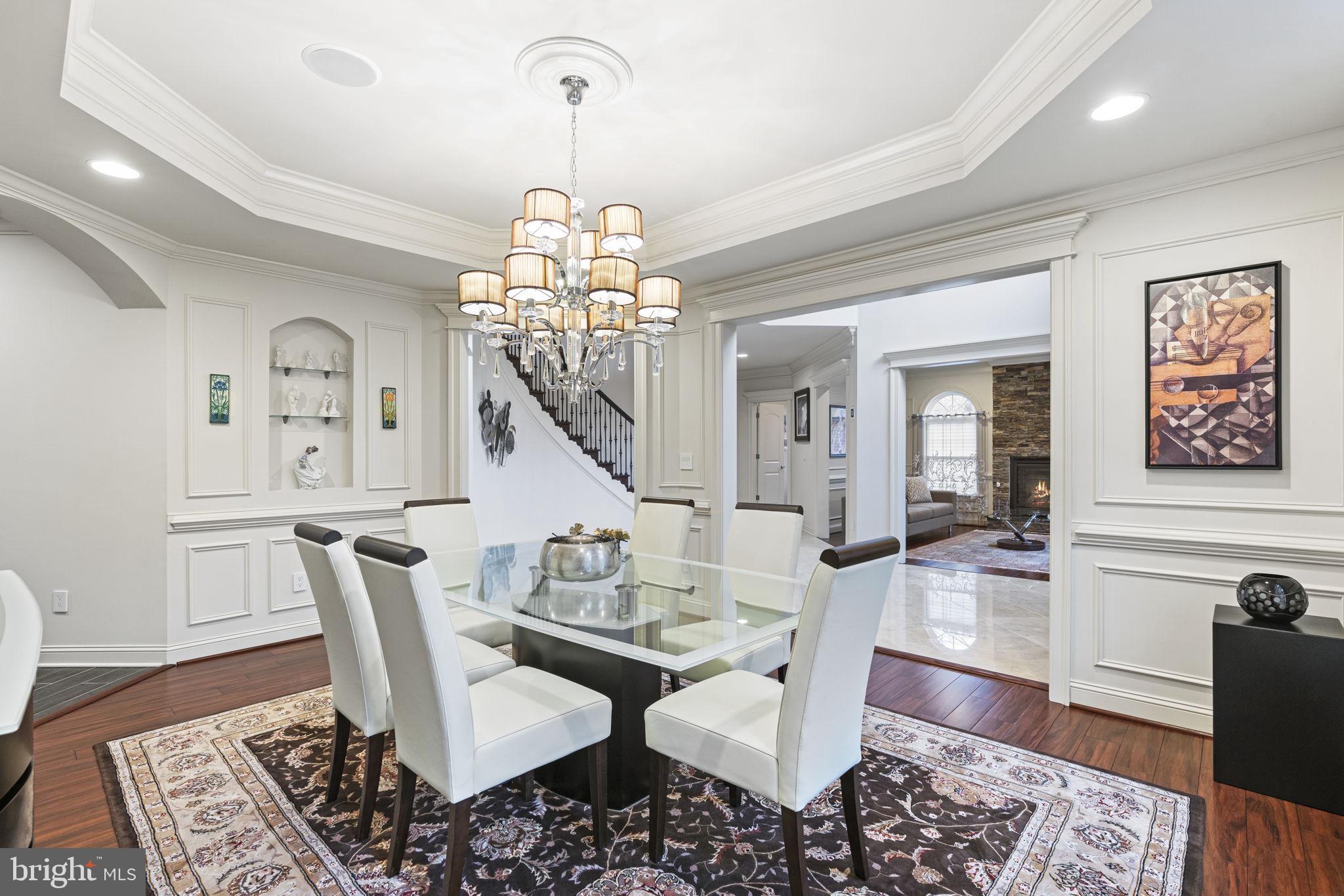 1204 Allendale Road McLean, VA 22101 - Photo 21 of 62 a view of a dining room with furniture a chandelier and wooden floor