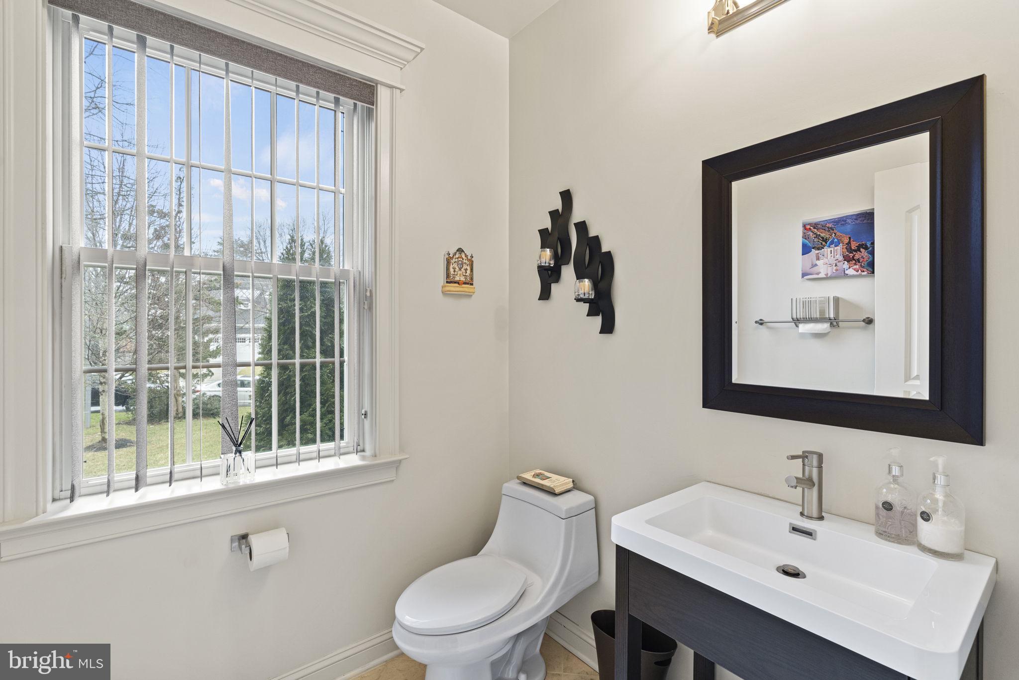 1204 Allendale Road McLean, VA 22101 - Photo 26 of 62 a bathroom with a toilet a sink and a mirror
