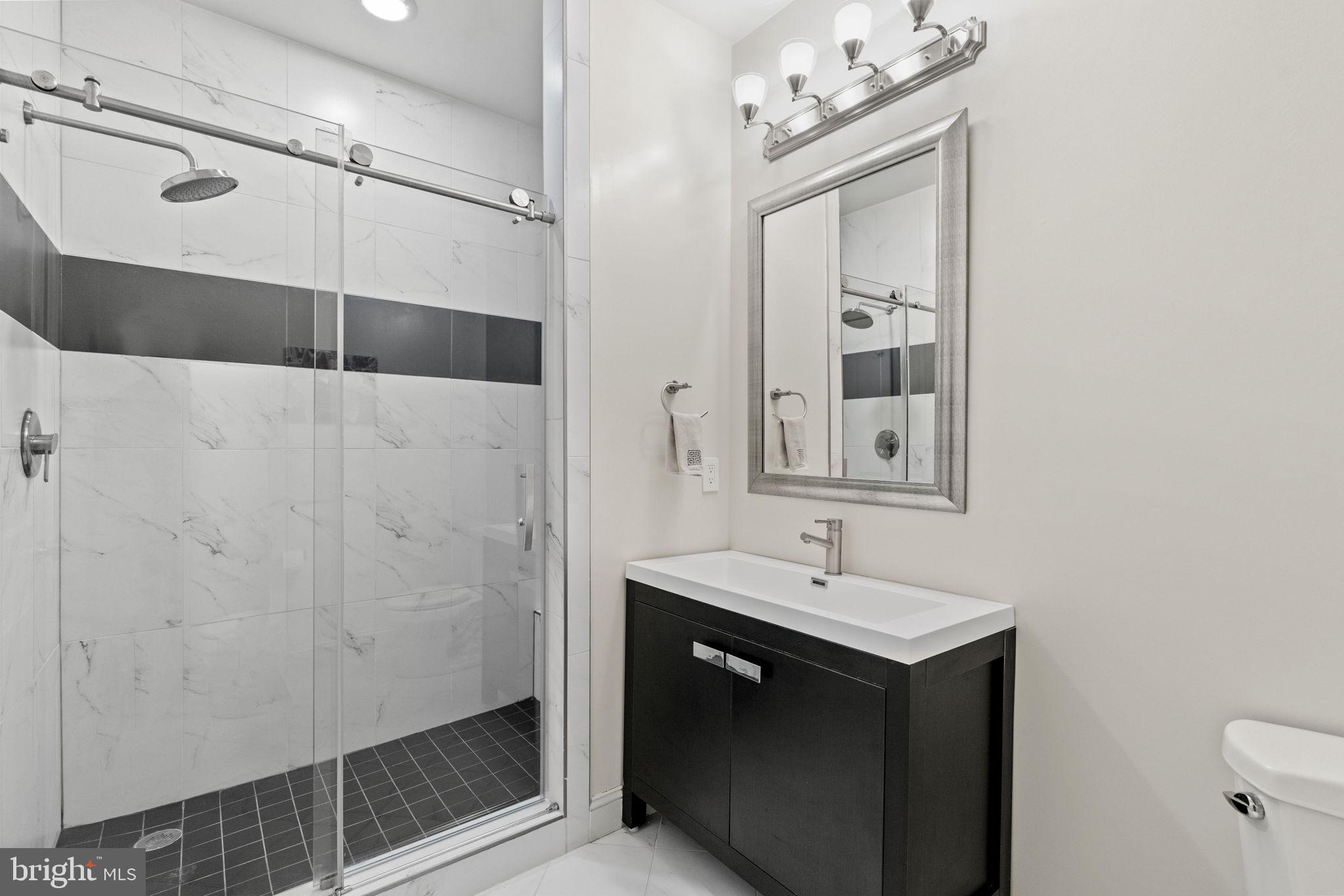 1204 Allendale Road McLean, VA 22101 - Photo 43 of 62 a bathroom with a sink vanity and a mirror