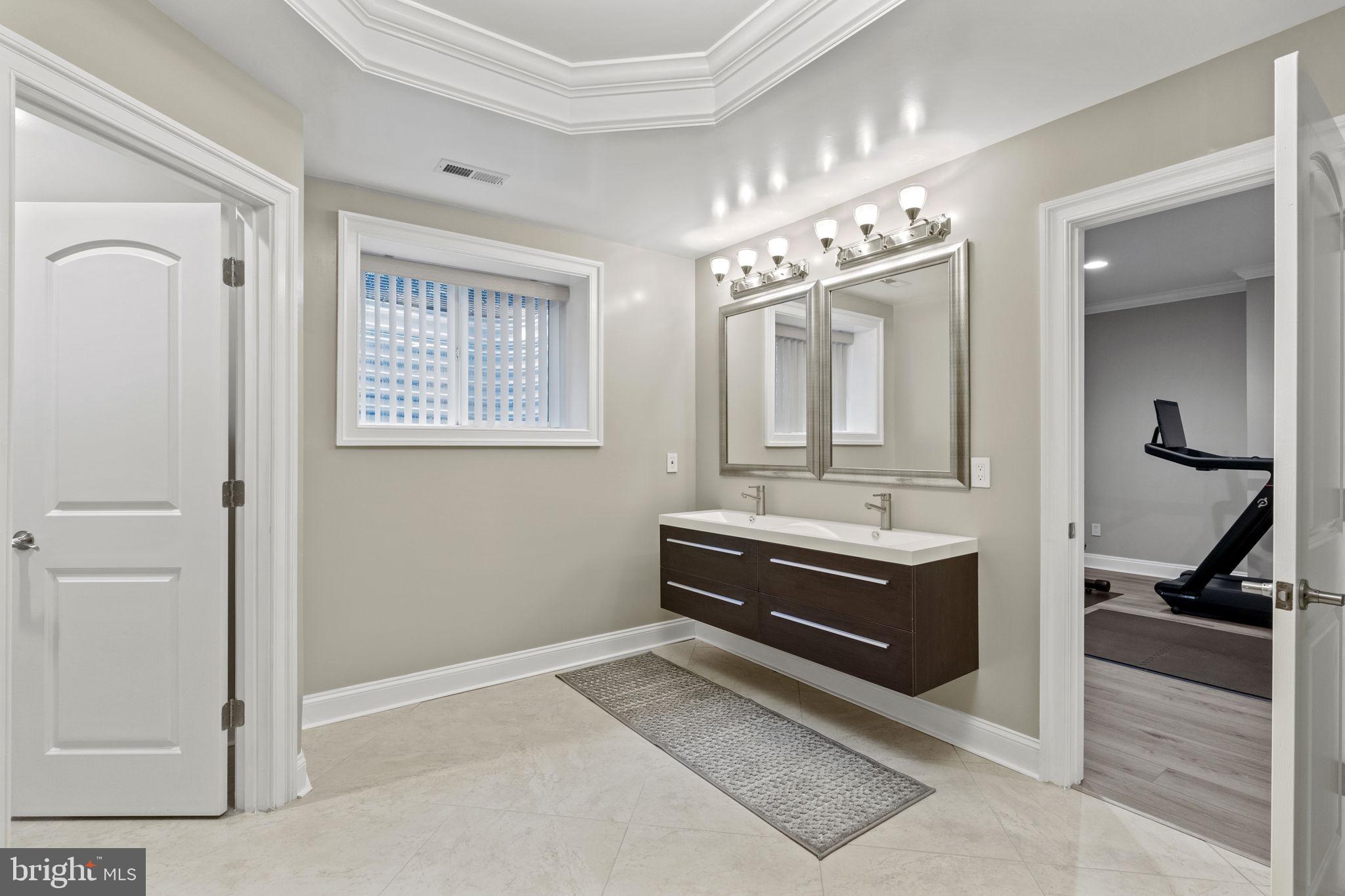 1204 Allendale Road McLean, VA 22101 - Photo 53 of 62 a bathroom with a sink and a mirror