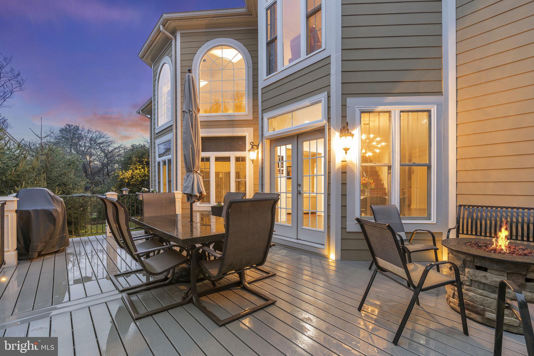 1204 Allendale Road McLean, VA 22101 - Photo 59 of 62 a view of a roof deck with table and chairs and wooden floor
