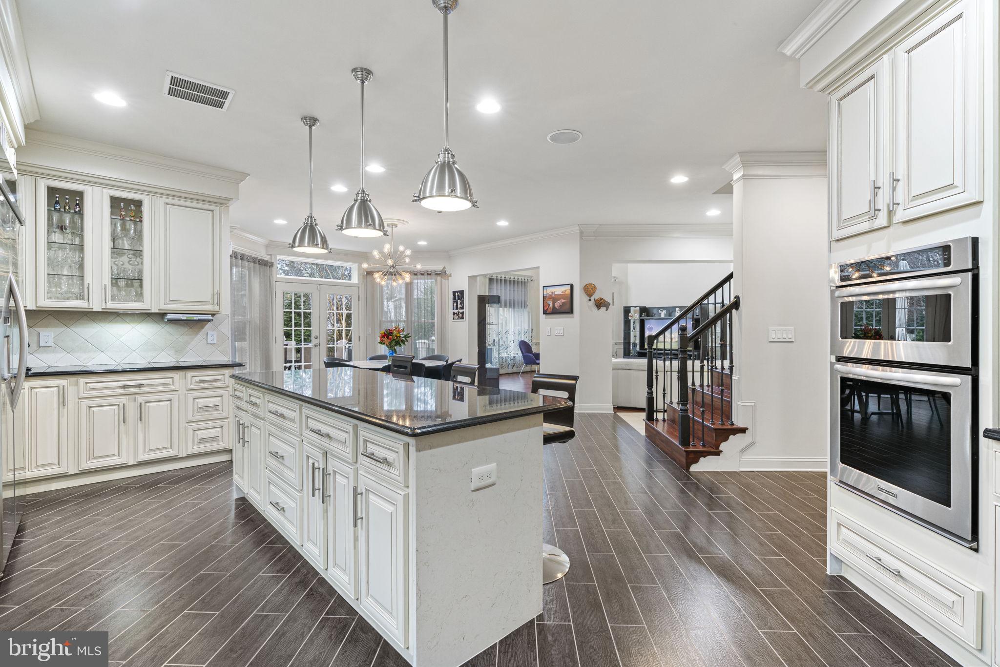 1204 Allendale Road McLean, VA 22101 - Photo 10 of 62 a kitchen with stainless steel appliances granite countertop a sink a stove and a wooden floors