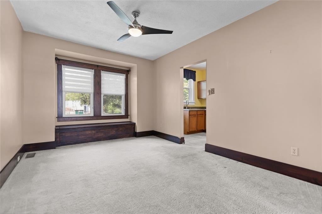 11 Butler Street Pittsburgh, PA 15209 - Photo 11 of 29 an empty room with windows and ceiling fan