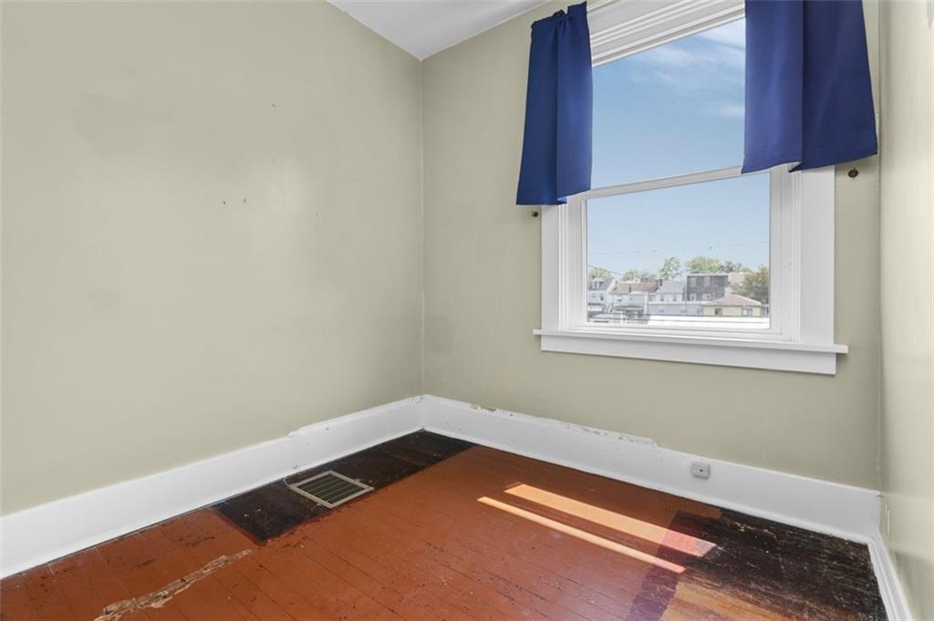 11 Butler Street Pittsburgh, PA 15209 - Photo 17 of 29 a view of a room with wooden floor and cabinet