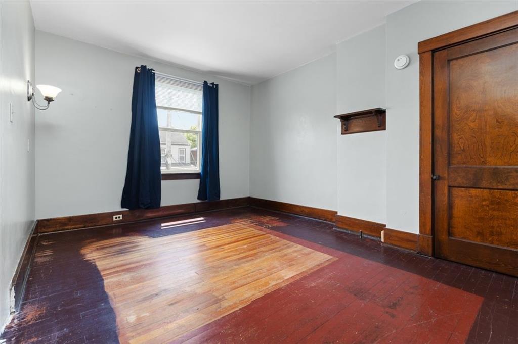 11 Butler Street Pittsburgh, PA 15209 - Photo 19 of 29 a view of empty room with wooden floor and fan