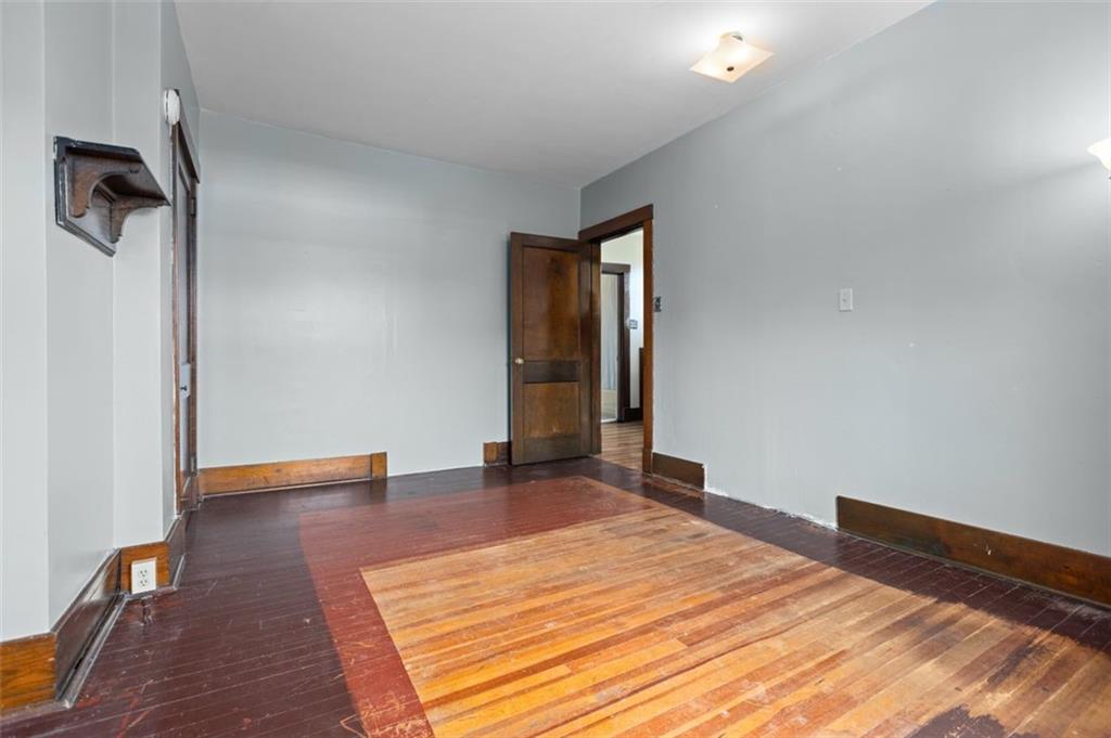 11 Butler Street Pittsburgh, PA 15209 - Photo 20 of 29 a view of an empty room with wooden floor