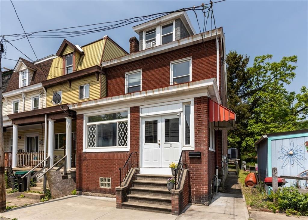 11 Butler Street Pittsburgh, PA 15209 - Photo 2 of 29 a front view of a house with a yard