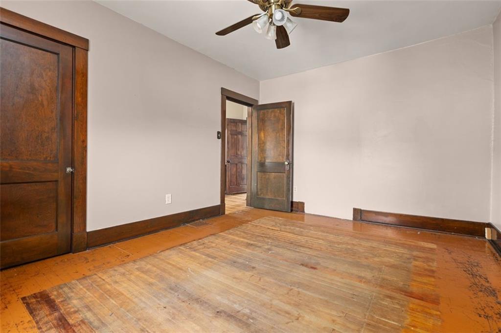 11 Butler Street Pittsburgh, PA 15209 - Photo 22 of 29 a view of an empty room with a ceiling fan