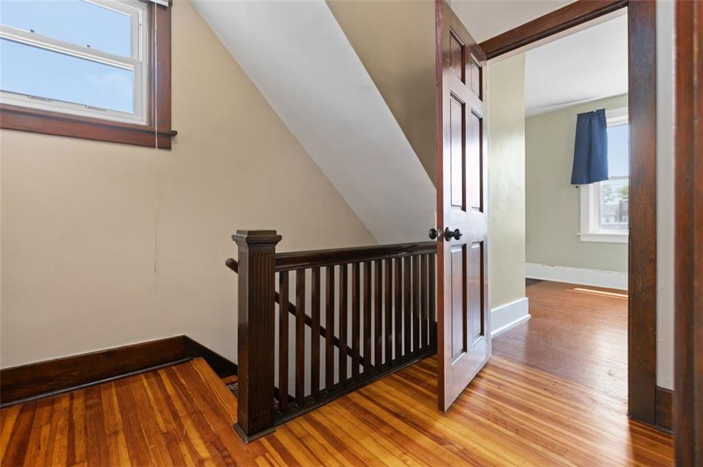 11 Butler Street Pittsburgh, PA 15209 - Photo 24 of 29 a view of a hallway with wooden floor and staircase