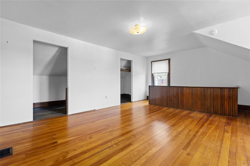 11 Butler Street Pittsburgh, PA 15209 - Photo 26 of 29 a view of empty room with wooden floor and fan