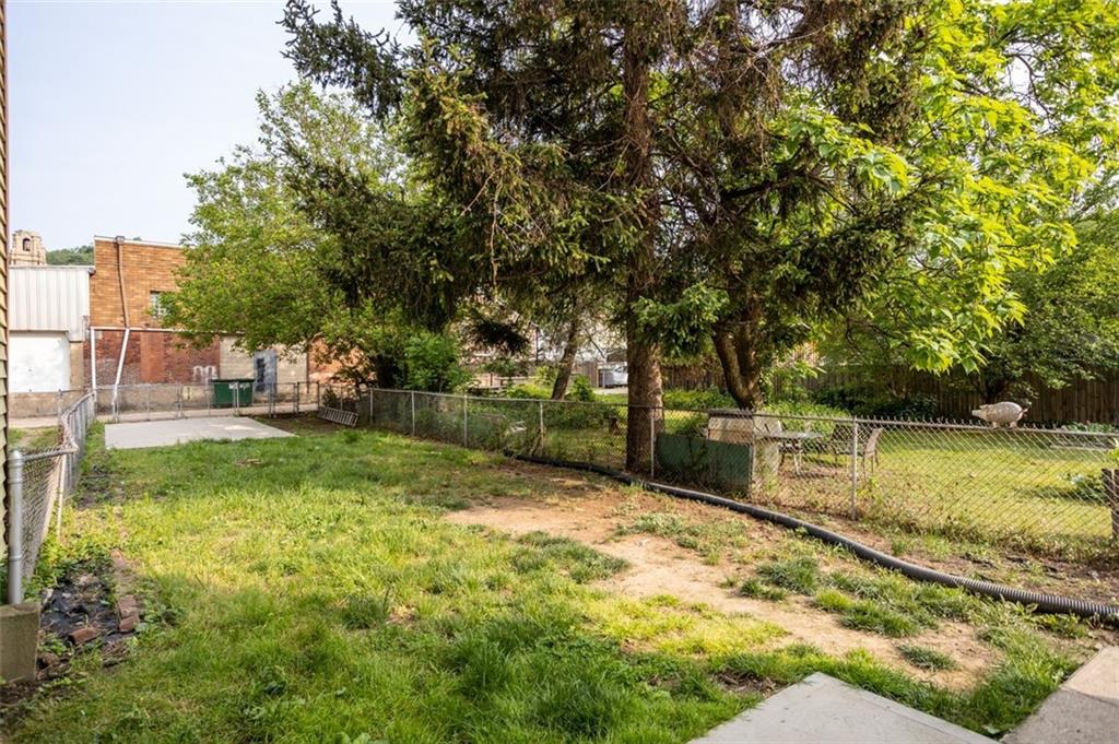 11 Butler Street Pittsburgh, PA 15209 - Photo 4 of 29 a view of a backyard with large trees
