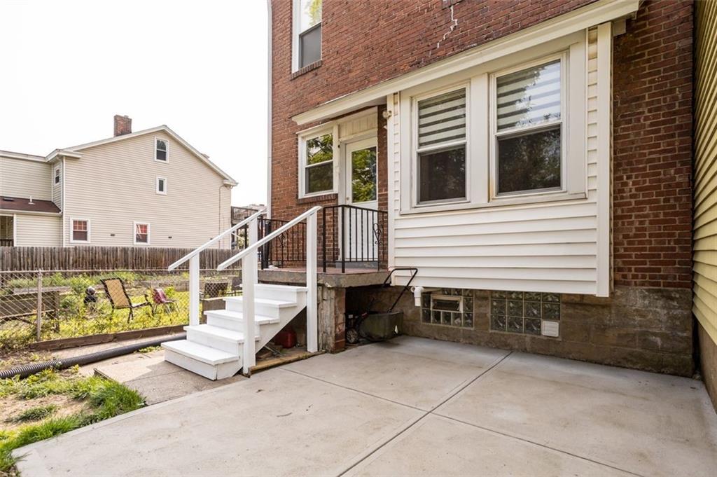 11 Butler Street Pittsburgh, PA 15209 - Photo 5 of 29 a view of a house with a wooden deck