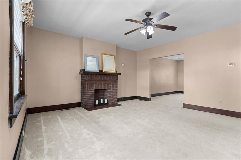 11 Butler Street Pittsburgh, PA 15209 - Photo 8 of 29 a view of an empty room with a fireplace