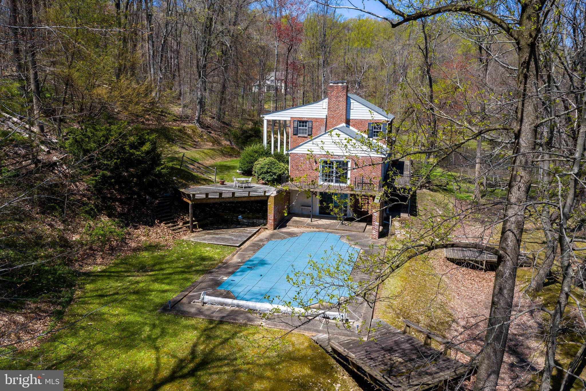 108 Township Line Road Exton, PA 19341 - Photo 22 of 60 Inground Pool with cement surround & patio