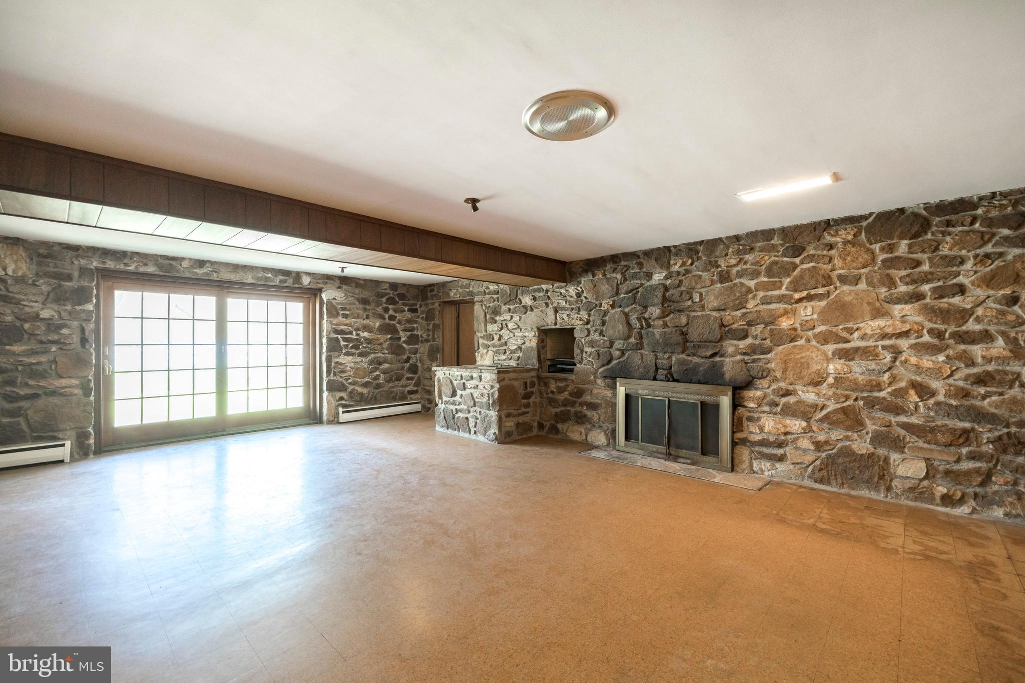 108 Township Line Road Exton, PA 19341 - Photo 40 of 60 Lower Family Room w/ stone wood-burning fireplace