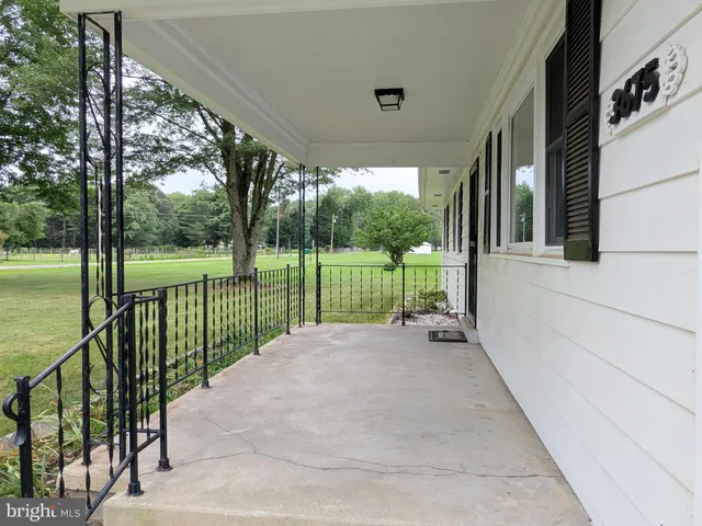 a view of backyard with mountain and ocean view