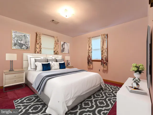 a bedroom with a bed and a couch