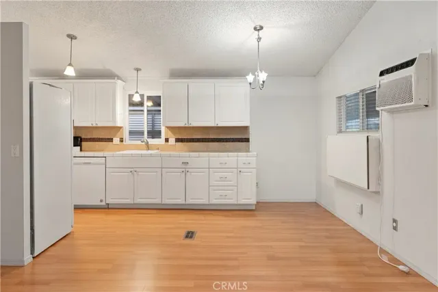 a kitchen with stainless steel appliances a refrigerator and a stove