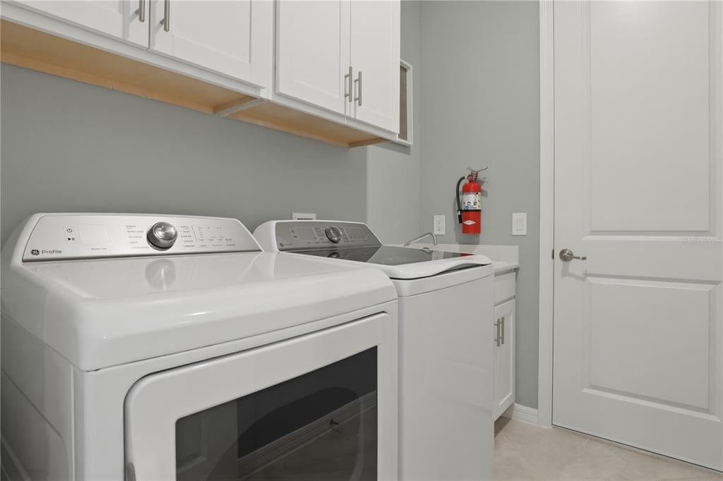 7153 Inlet Isles Lakewood Ranch, FL 34202 - Photo 23 of 26 a utility room with dryer and washer