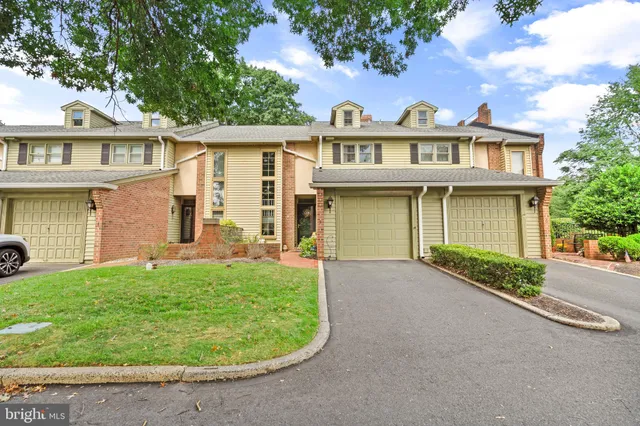 front view of a house with a garden