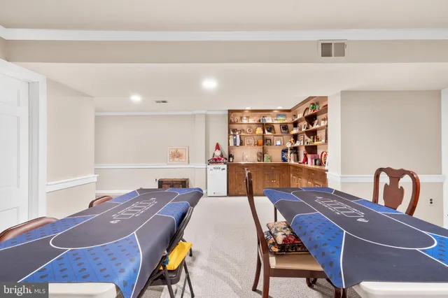a view of a dining room with furniture and a rug