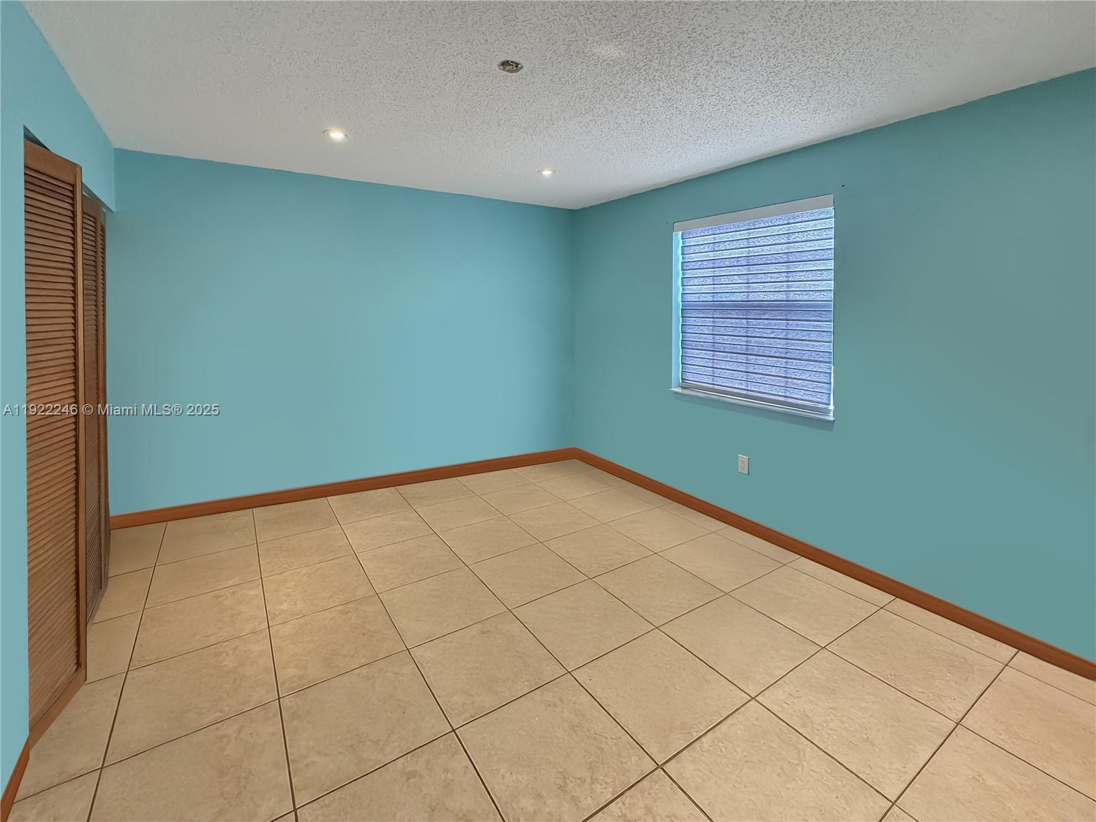 12759 Southwest 146th Terrace Miami, FL 33186 - Photo 2 of 10 a view of an empty room with a window