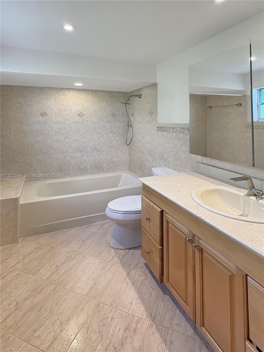 12759 Southwest 146th Terrace Miami, FL 33186 - Photo 5 of 10 a bathroom with a sink a toilet and bathtub