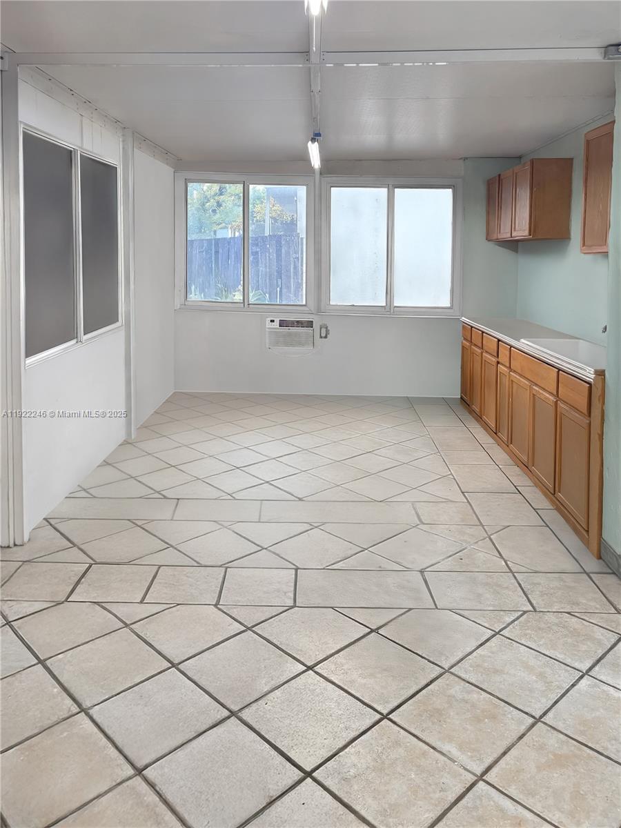 12759 Southwest 146th Terrace Miami, FL 33186 - Photo 9 of 10 an empty room with windows