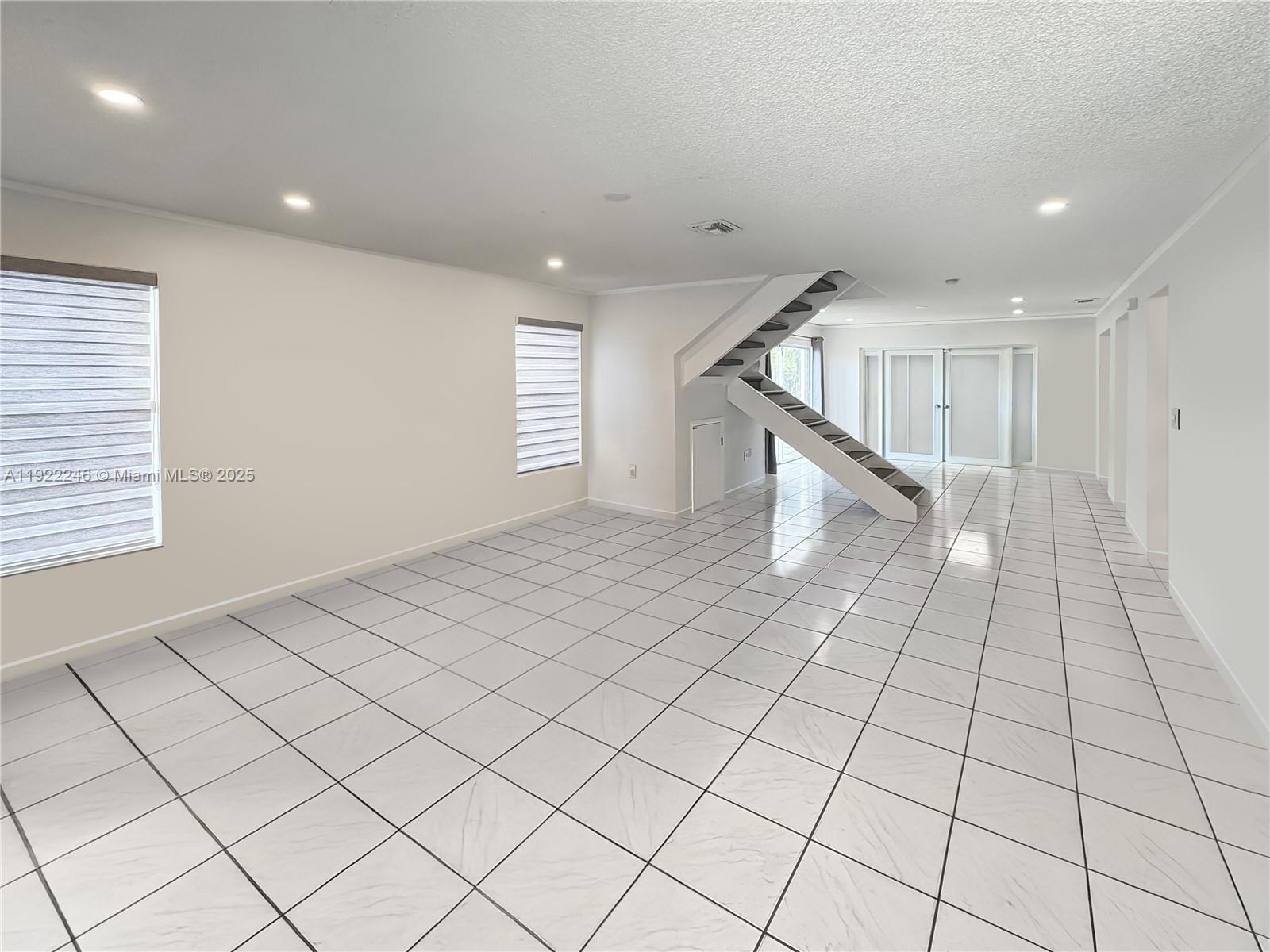 12759 Southwest 146th Terrace Miami, FL 33186 - Photo 10 of 10 a view of an empty room and window