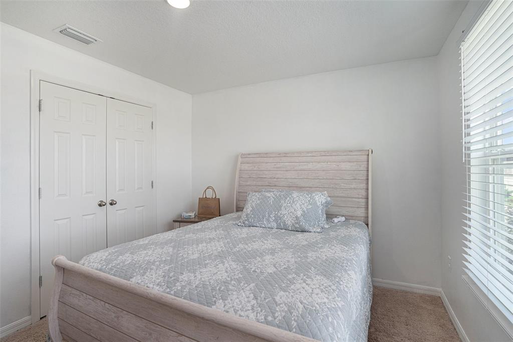 13005 Upward Place Riverview, FL 33579 - Photo 14 of 27 a bedroom with a bed and a window