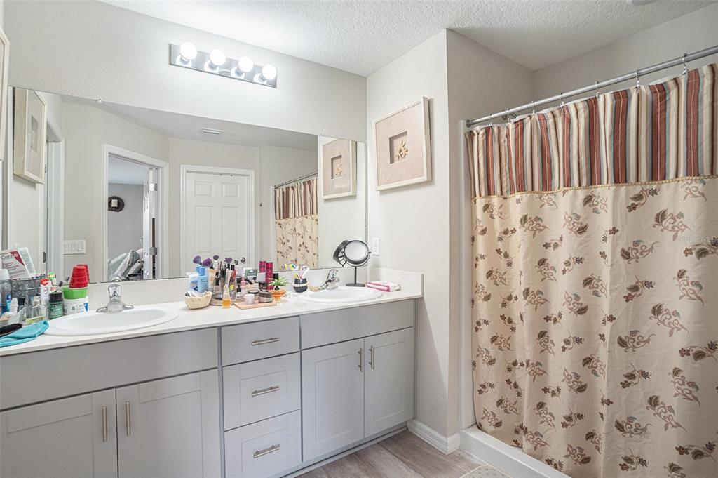 13005 Upward Place Riverview, FL 33579 - Photo 14 of 28 a bathroom with a sink and a mirror
