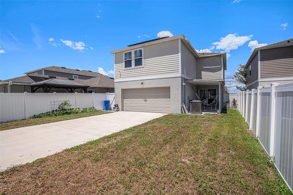13005 Upward Place Riverview, FL 33579 - Photo 23 of 27 a front view of a house with a yard and a garage