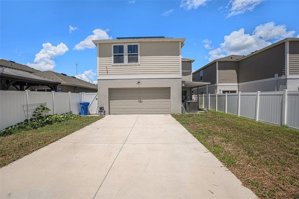 13005 Upward Place Riverview, FL 33579 - Photo 24 of 27 a front view of a house with a yard and a garage