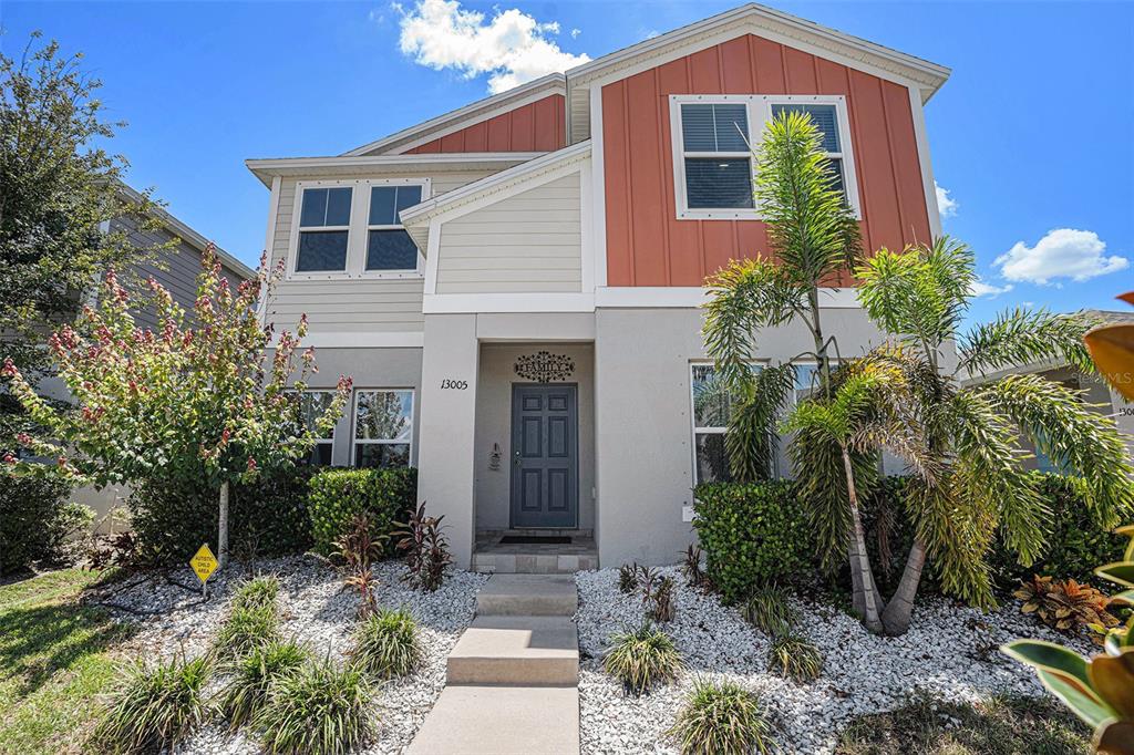 13005 Upward Place Riverview, FL 33579 - Photo 3 of 28 a front view of a house with garden