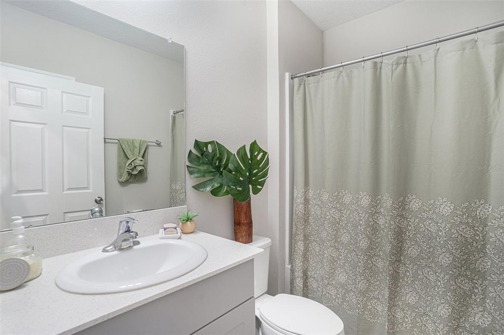 13005 Upward Place Riverview, FL 33579 - Photo 9 of 28 a bathroom with a sink toilet and mirror