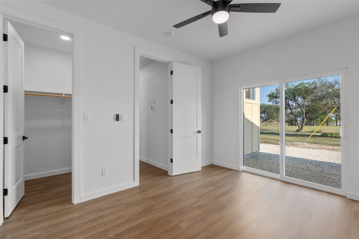 533 Hackberry Road, Unit A & B Salado, TX 76571 - Photo 8 of 17 a view of an empty room with wooden floor and a window