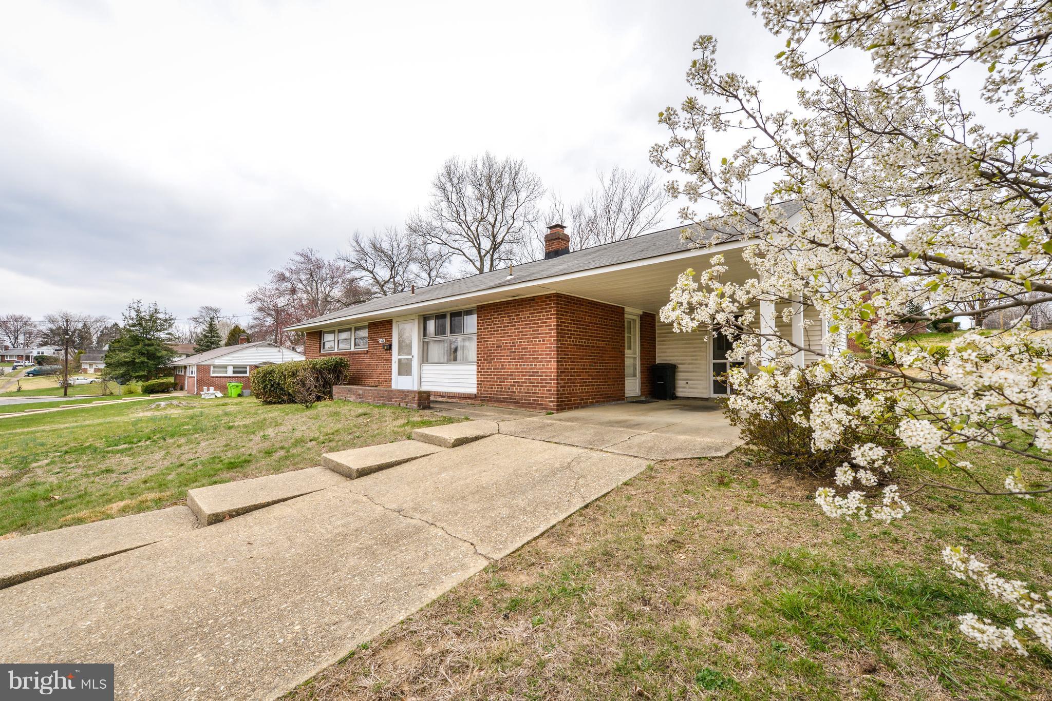 5201 Columbia Road Springfield, VA 22151 - Photo 3 of 14 a view of a house with a yard and garage