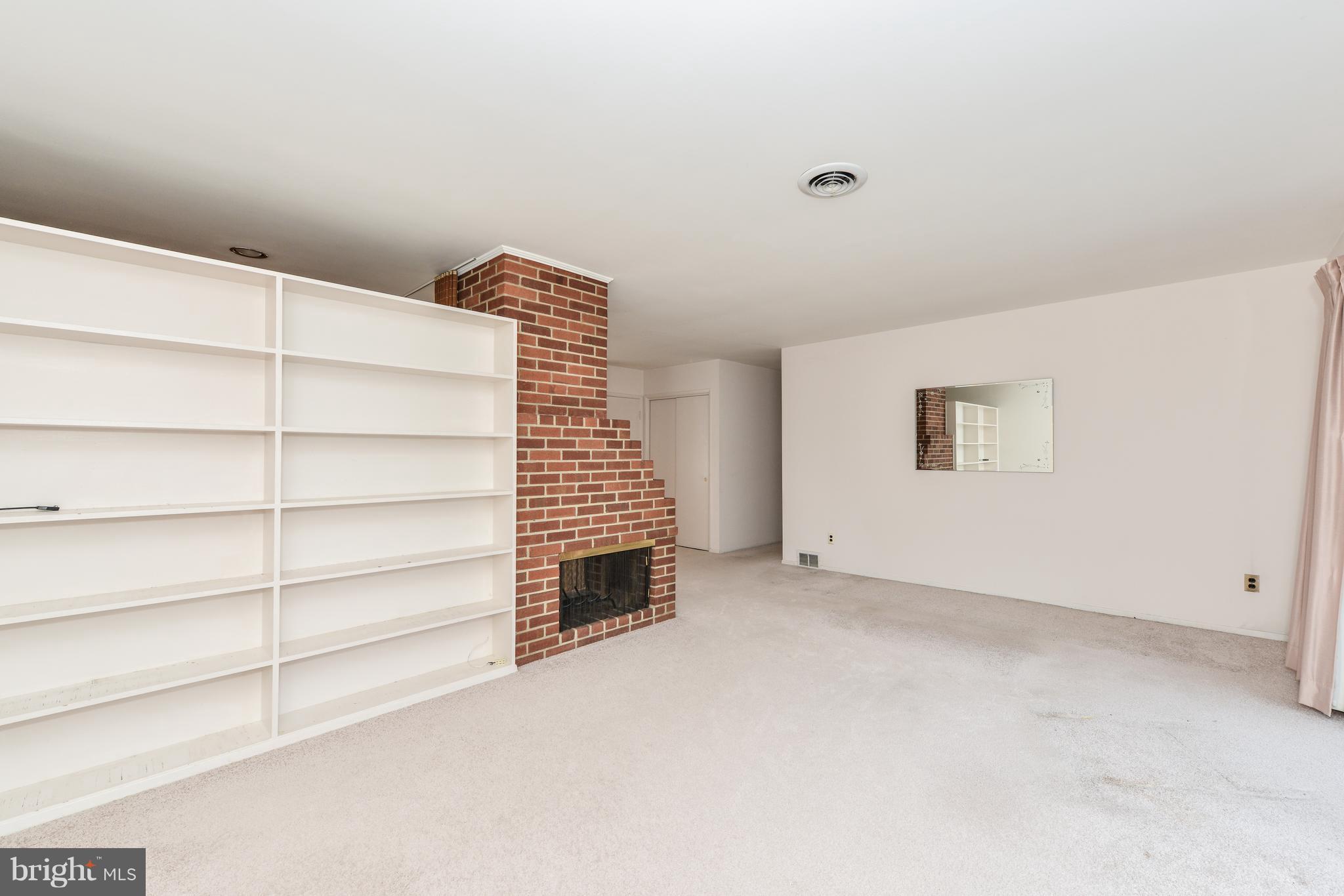 5201 Columbia Road Springfield, VA 22151 - Photo 8 of 14 a view of an empty room with a fireplace